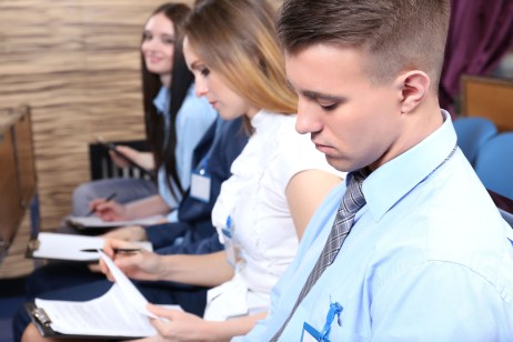 Audience listening to presentation at conference